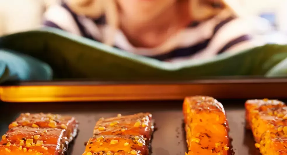 seabear deal hero woman cooking salmon