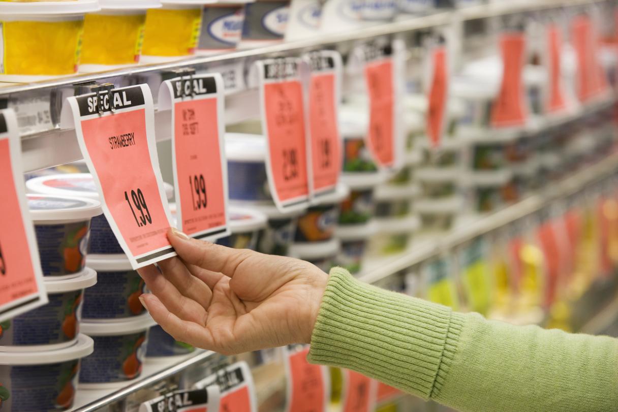 woman looking at sale tag