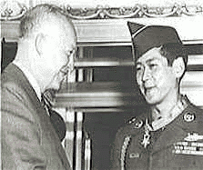 President Dwight D. Eisenhower congratulates Staff Sergeant Hiroshi H. Miyamura upon his much-belated receipt of his Medal of Honor during the formal award ceremony at the White House on October 27, 1953 Courtesy of National Archives