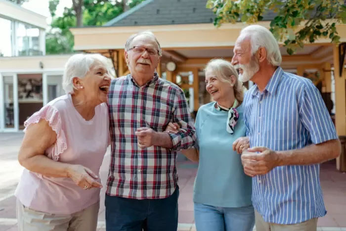 Group of four senior friends enjoying their afternoon together.