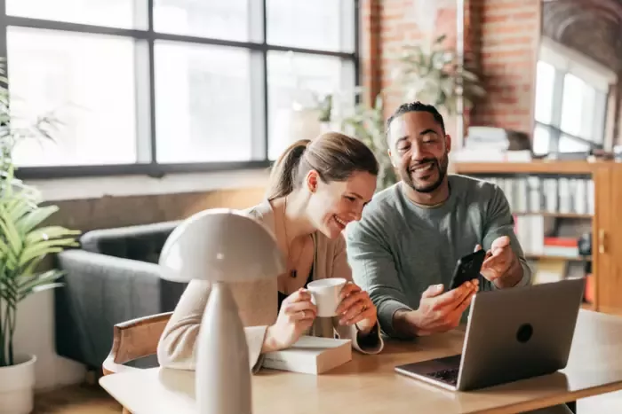 couple in front of laptop
