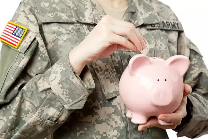 American Soldier with Piggy bank