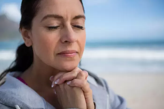 Woman pauses for a moment of silence