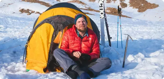 Stacy Bare in front of his tent