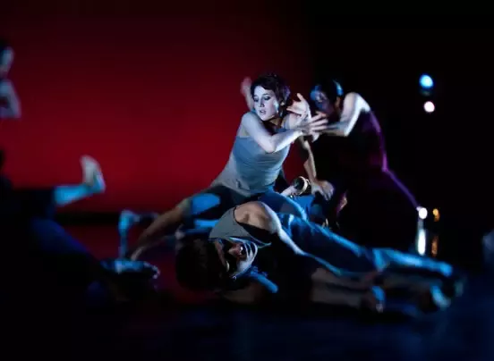John Maniaci/Courtesy of Georgetown University Department of Performing Arts - Sarah Parker, Yoko Sugimoto-Ikezawa and Joe Jehle perform Robin Becker's "Into Sunlight." The dance is a collection of images, such as a boat that took soldiers across the ocean and a football star who is cut down by bullets.