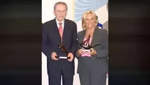 Donna de Varona with IOC President Dr. Jacques Rogge
