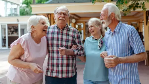 Group of four senior friends enjoying their afternoon together.