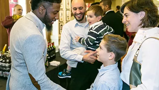 Olympian Brycen Spratling poses with WeSalute (Veterans Advantage) members at Heroes Meet Heroes 2015