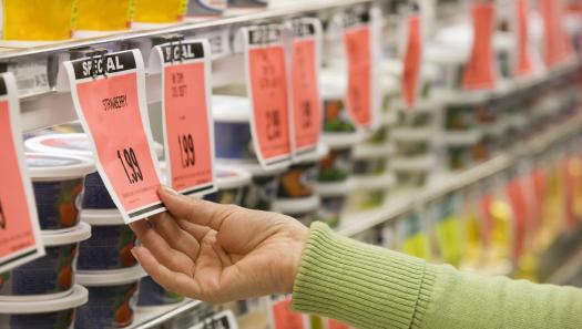 woman looking at sale tag