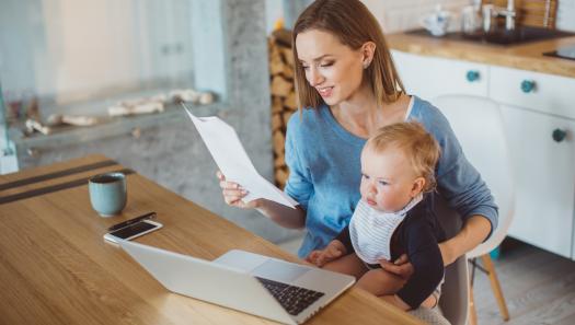 Mother with child reviewing budget