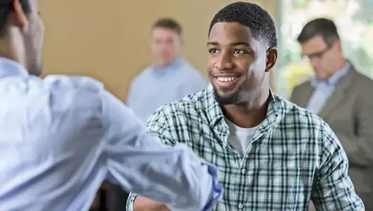 Veteran in a job interview shaking hands