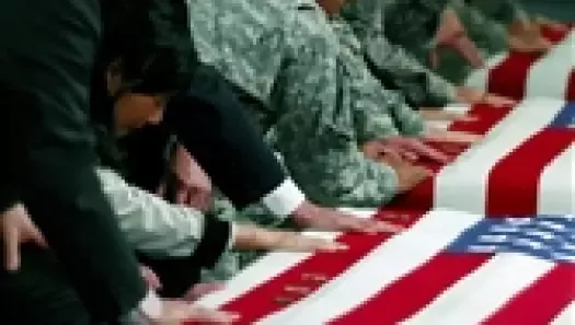 Members of the International Security Assistance Force and senior officials from the U.S. Embassy in Kabul, Afghanistan, pay their respects to nine U.S. soldiers killed in Nuristan province during a ramp ceremony at Bagram Air Field, Afghanistan. State Department 