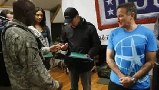 Some 500 American soldiers watched an all-star USO cast perform under a steady snowstorm at a U.S. base in Kabul late Thursday.