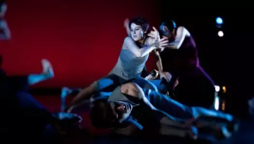 John Maniaci/Courtesy of Georgetown University Department of Performing Arts - Sarah Parker, Yoko Sugimoto-Ikezawa and Joe Jehle perform Robin Becker's "Into Sunlight." The dance is a collection of images, such as a boat that took soldiers across the ocean and a football star who is cut down by bullets.