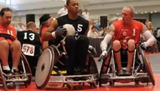 Veterans competing in quad rugby.